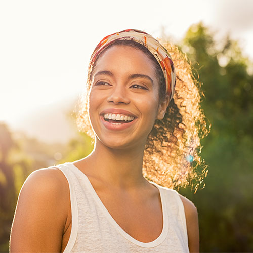 young woman with nice teeth outside